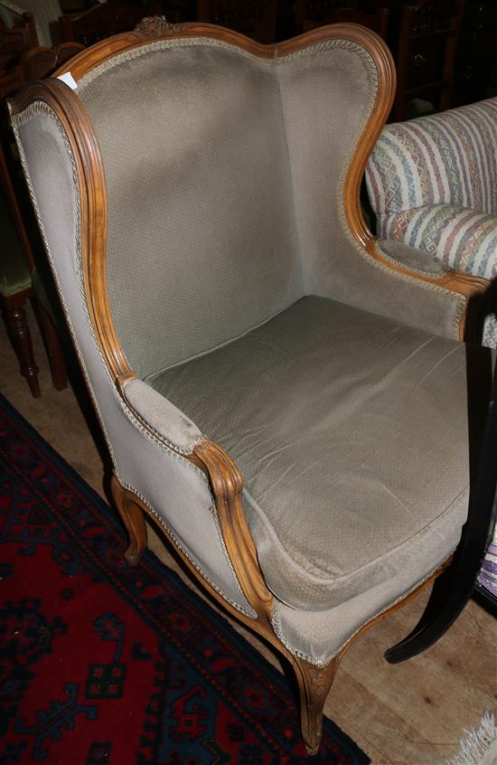 Late 19th century French beech framed enclosed wing-back armchair(-)